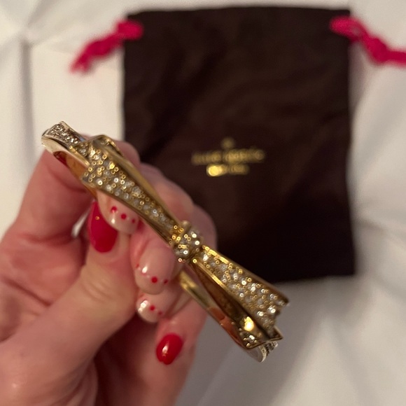 kate spade Jewelry Kate Spade Gold Bow Bangle Worn Clear Stones